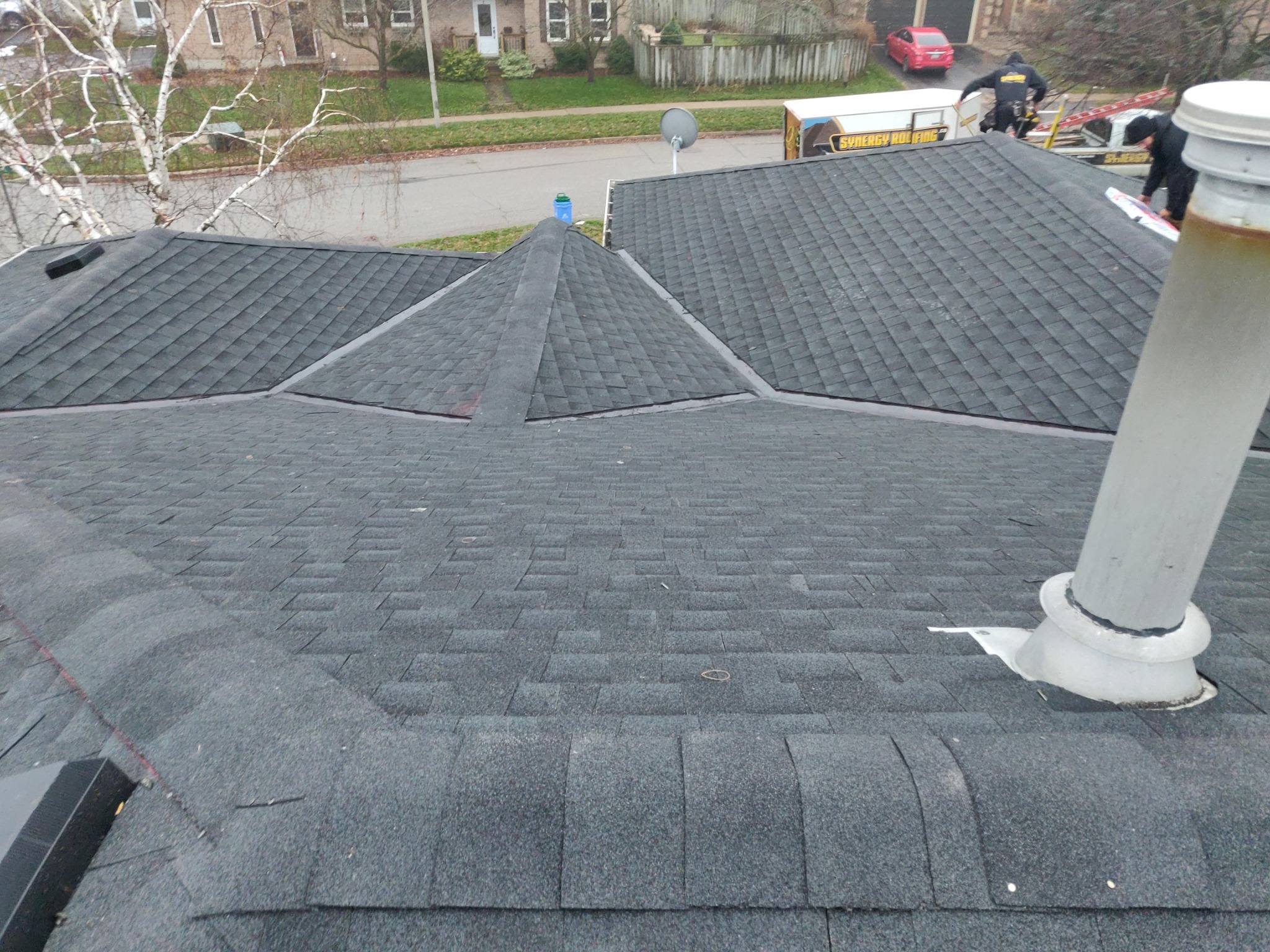 Completed shingle roof and intersecting valleys from the same job as the yellow IKO AquaBarrier preparation photos